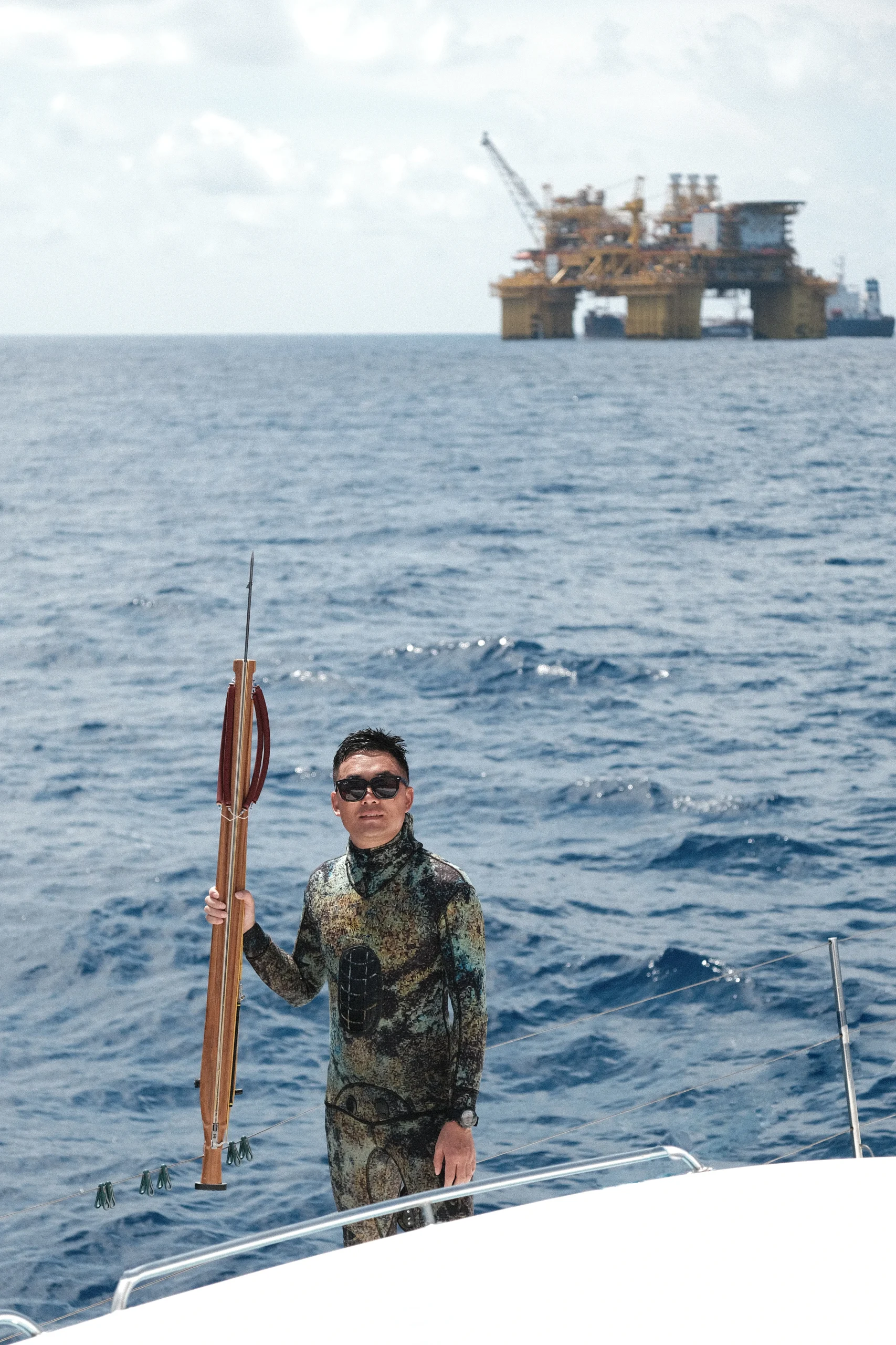 Close-up of the smooth teak wood grain and finish of Rogennie.