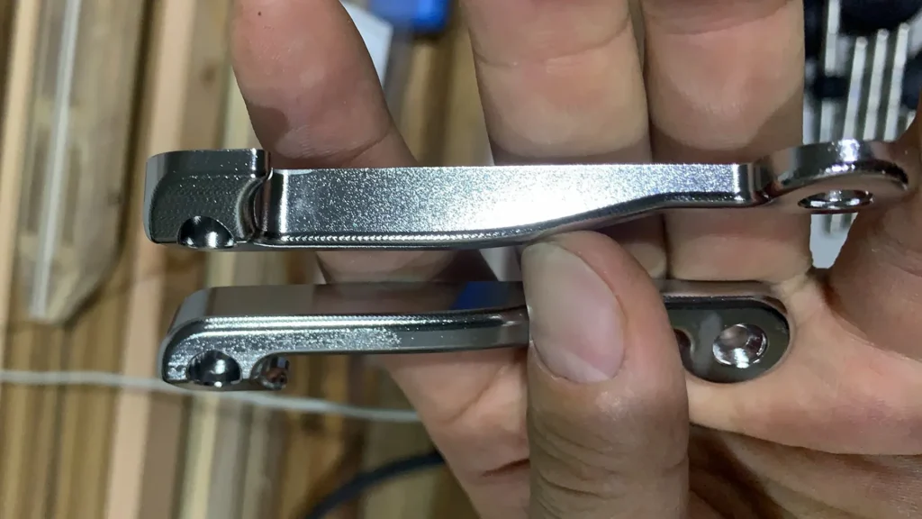 Rogennie brand logo engraved on a custom teak speargun.